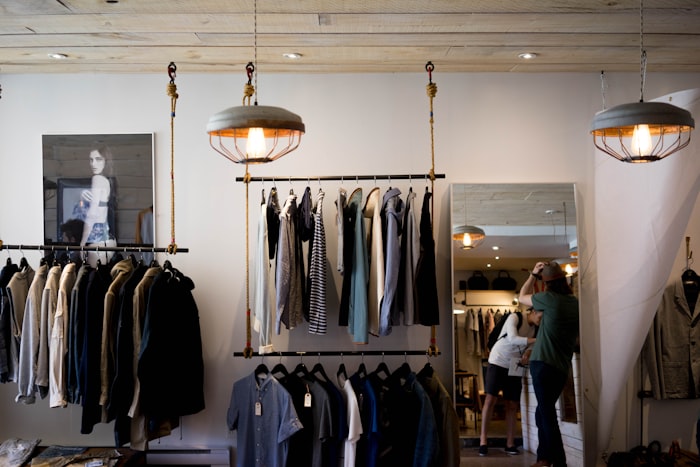 Clothing arranged on racks in a boutique retail store